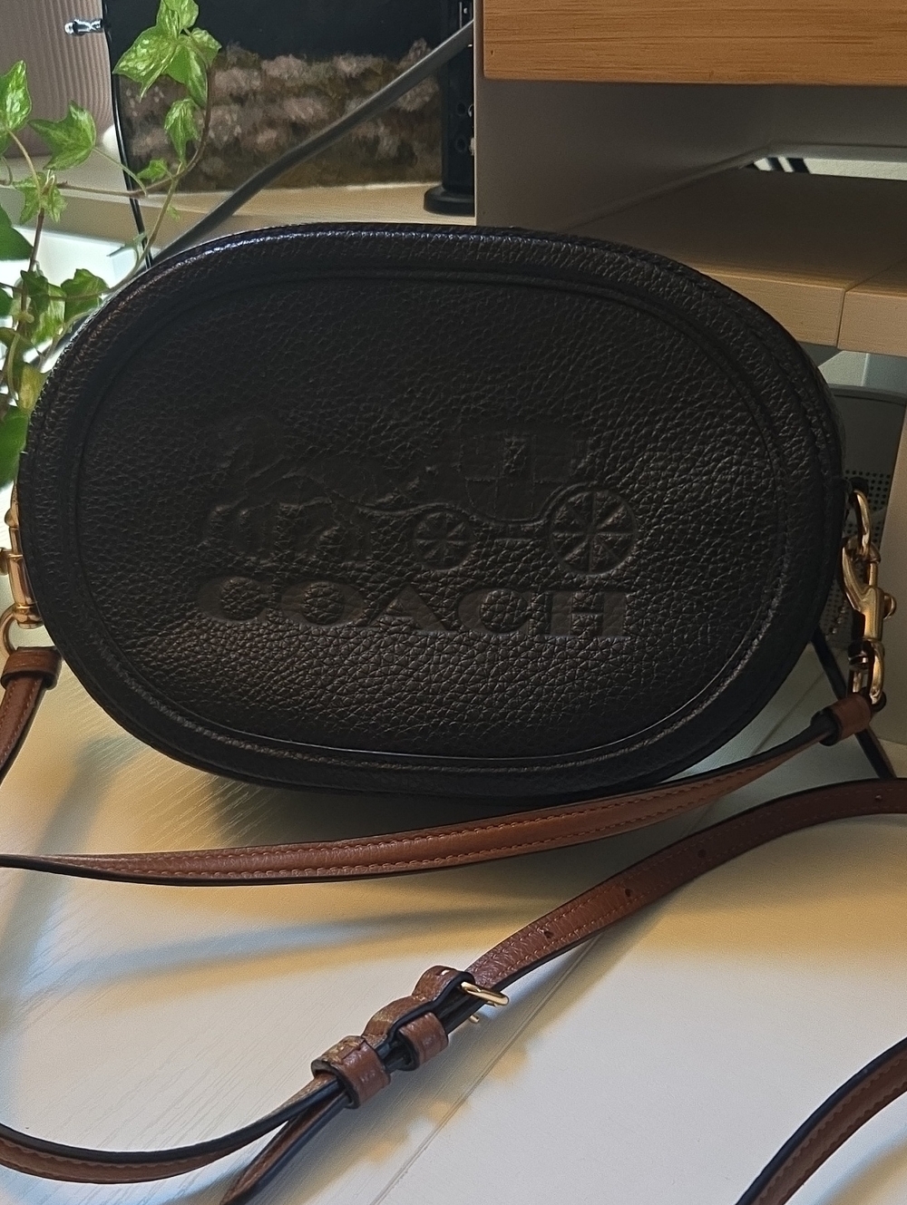 Coach Black Pebbled Leather Oval Crossbody with Brown Strap and Gold Hardware